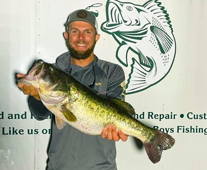 FWC photo of  Harry Linsinbigler holding his pink-tagged trophy bass