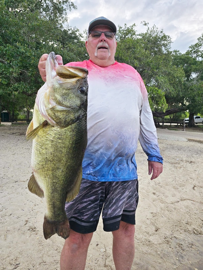 Photo of Bruce Doolittle, Sr. with his trophy size bass, courtesy of FWC.